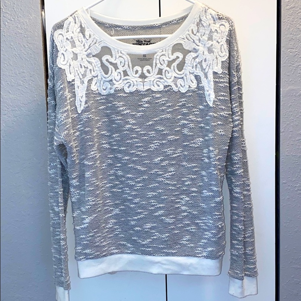 Light sweater, with mesh design at top.